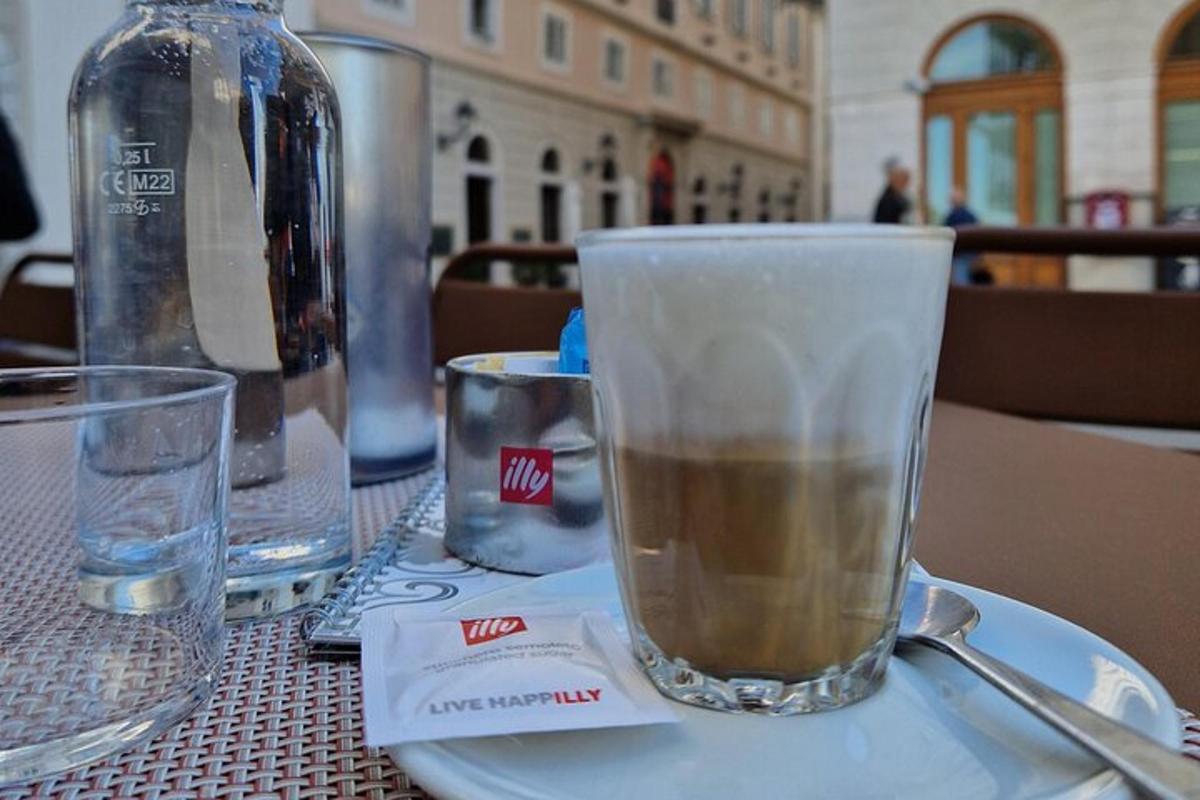 a glass of coffee sitting on a table
