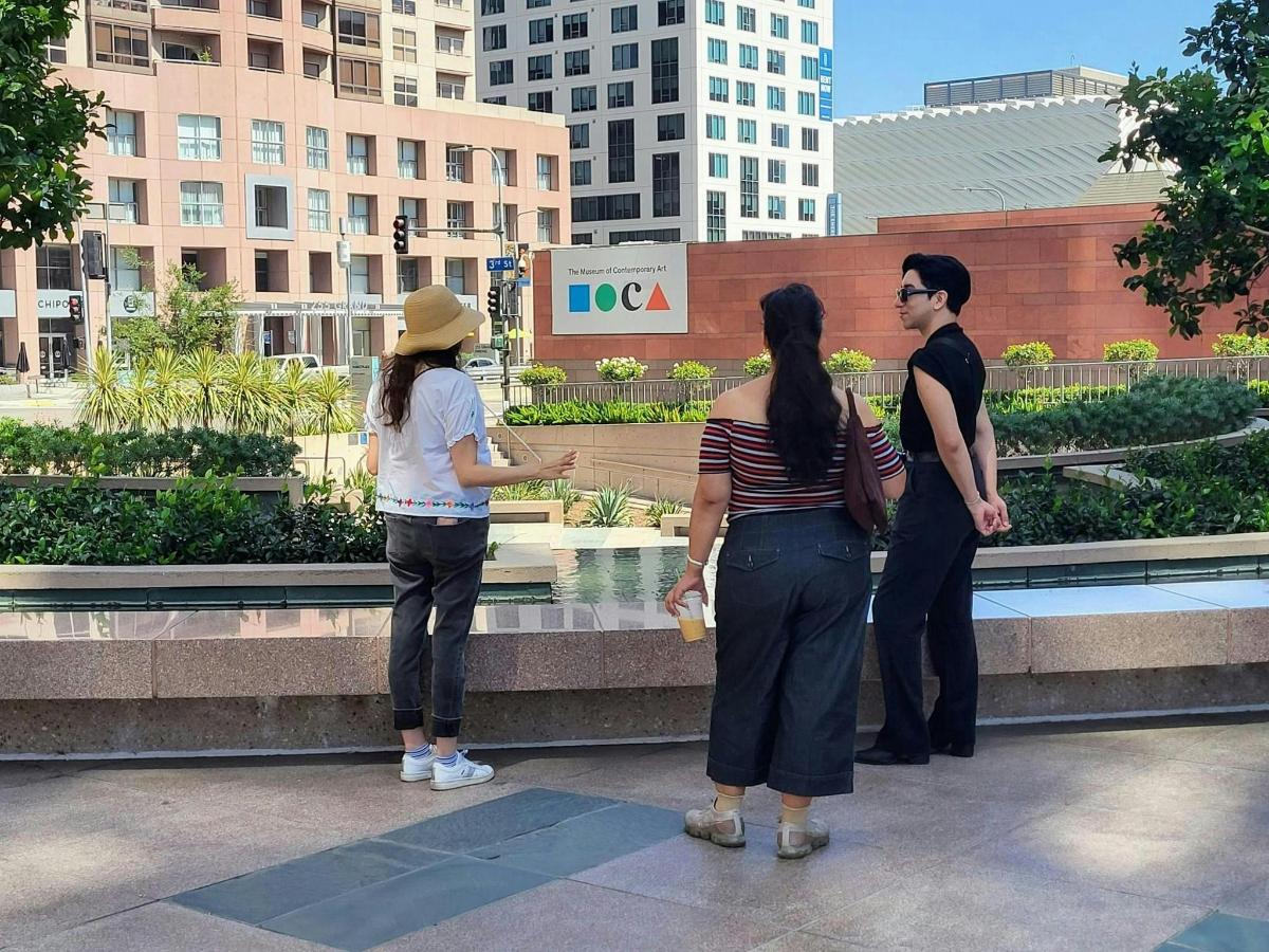 a group of people standing in front of a building