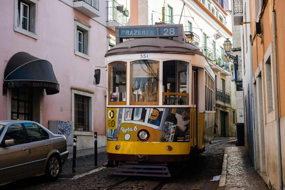 a yellow trolley car driving down a street