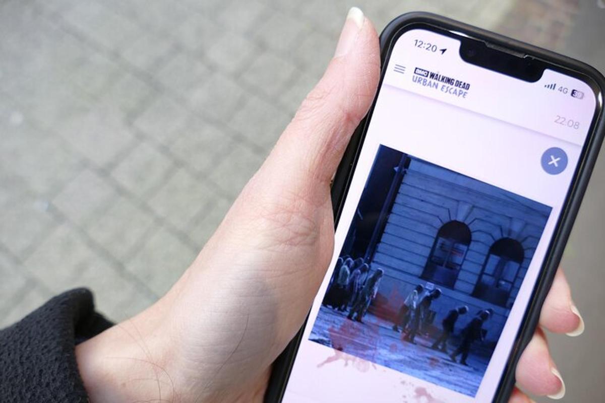a person holding a cell phone in their hand