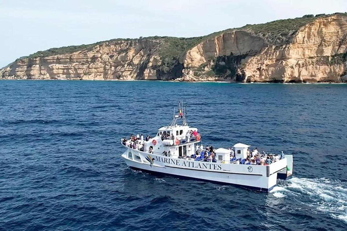 a group of people on a boat in the water