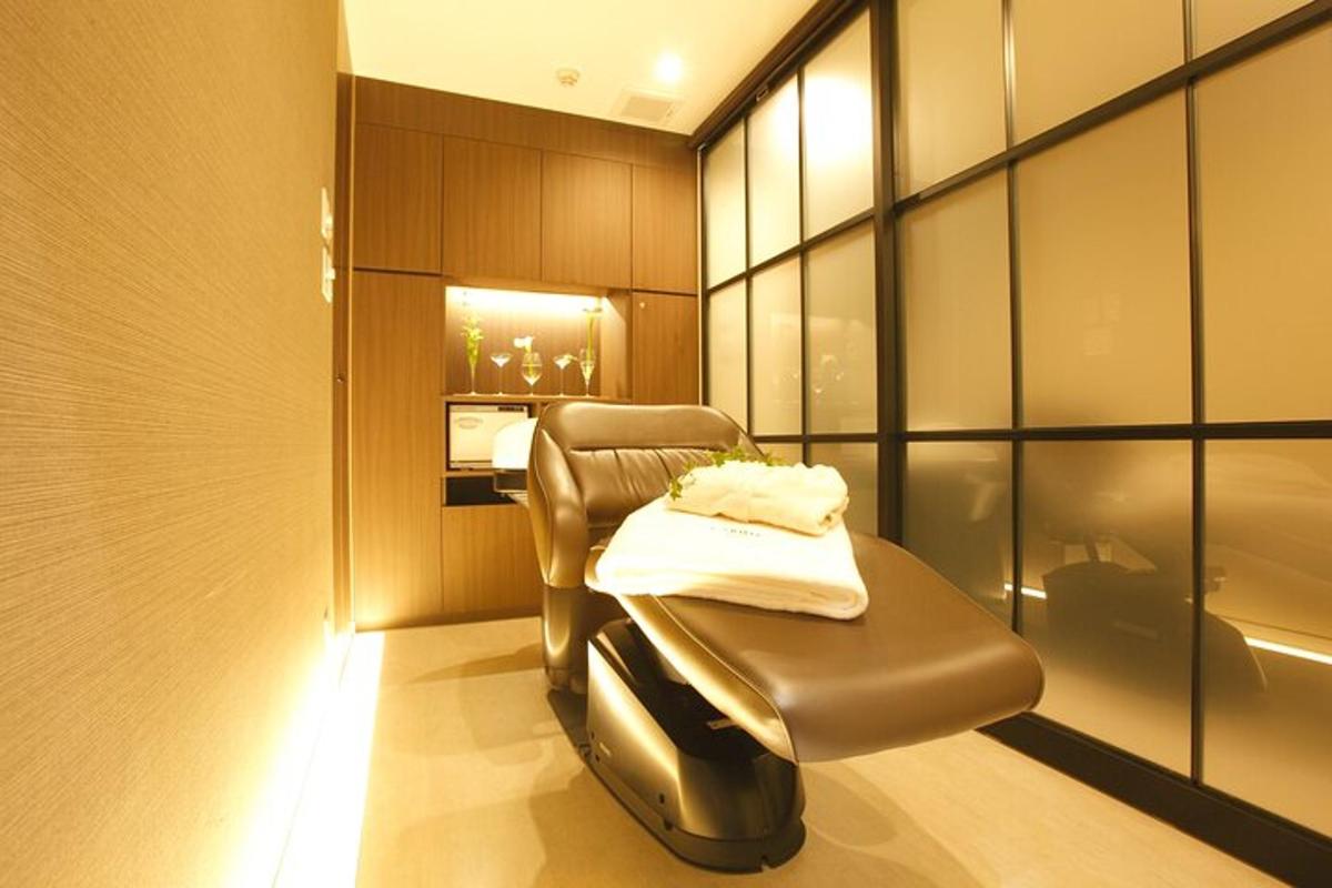 a spa room with a chair and a table
