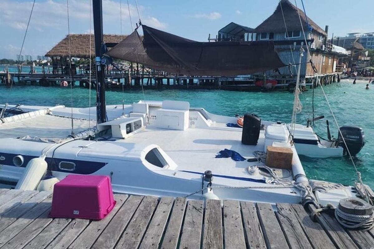 a boat is docked at a dock in the water