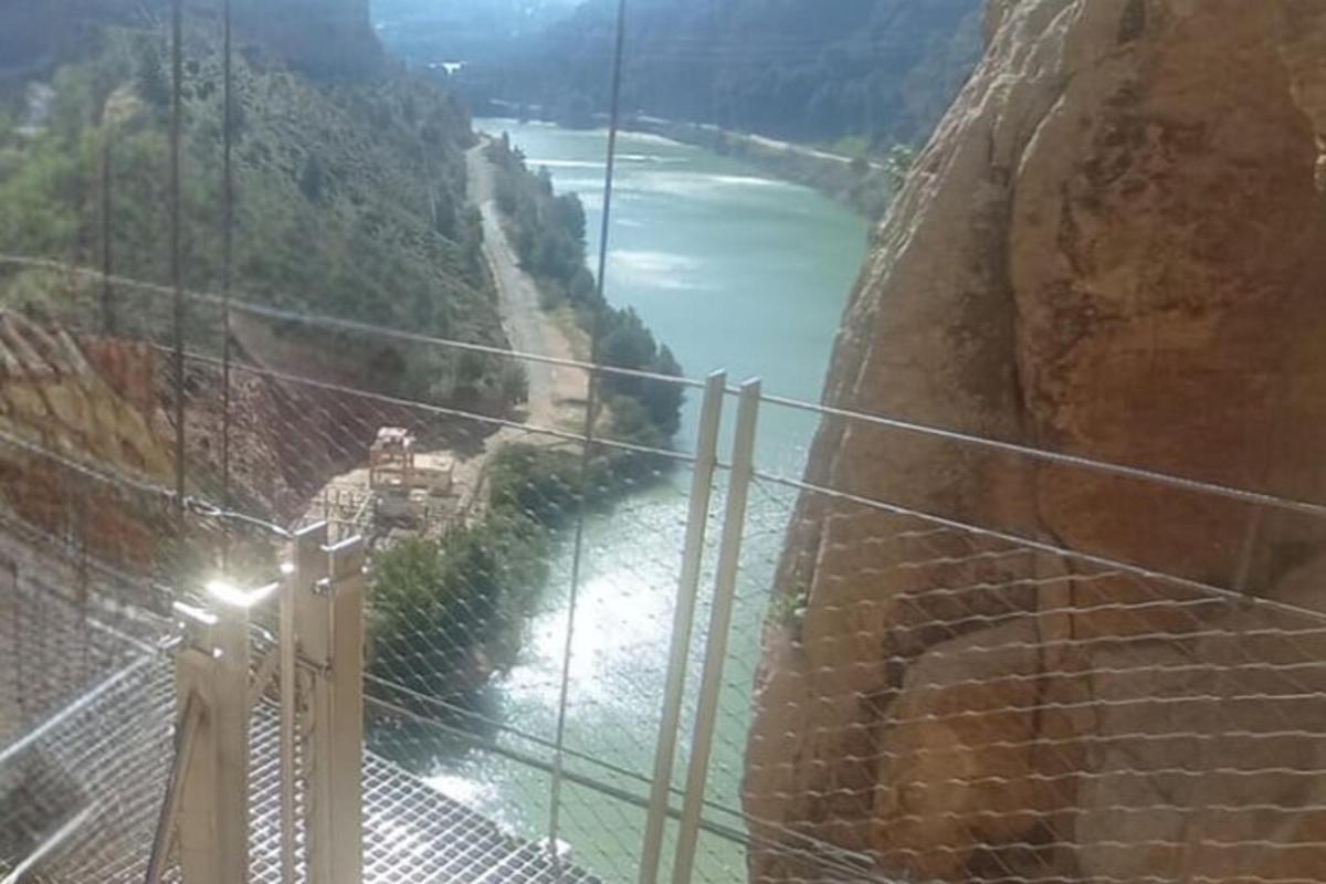 a view of a suspension bridge over a river