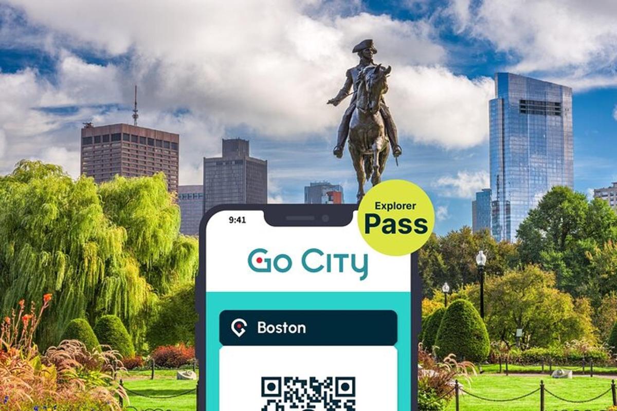 a sign in a park with a statue in the background