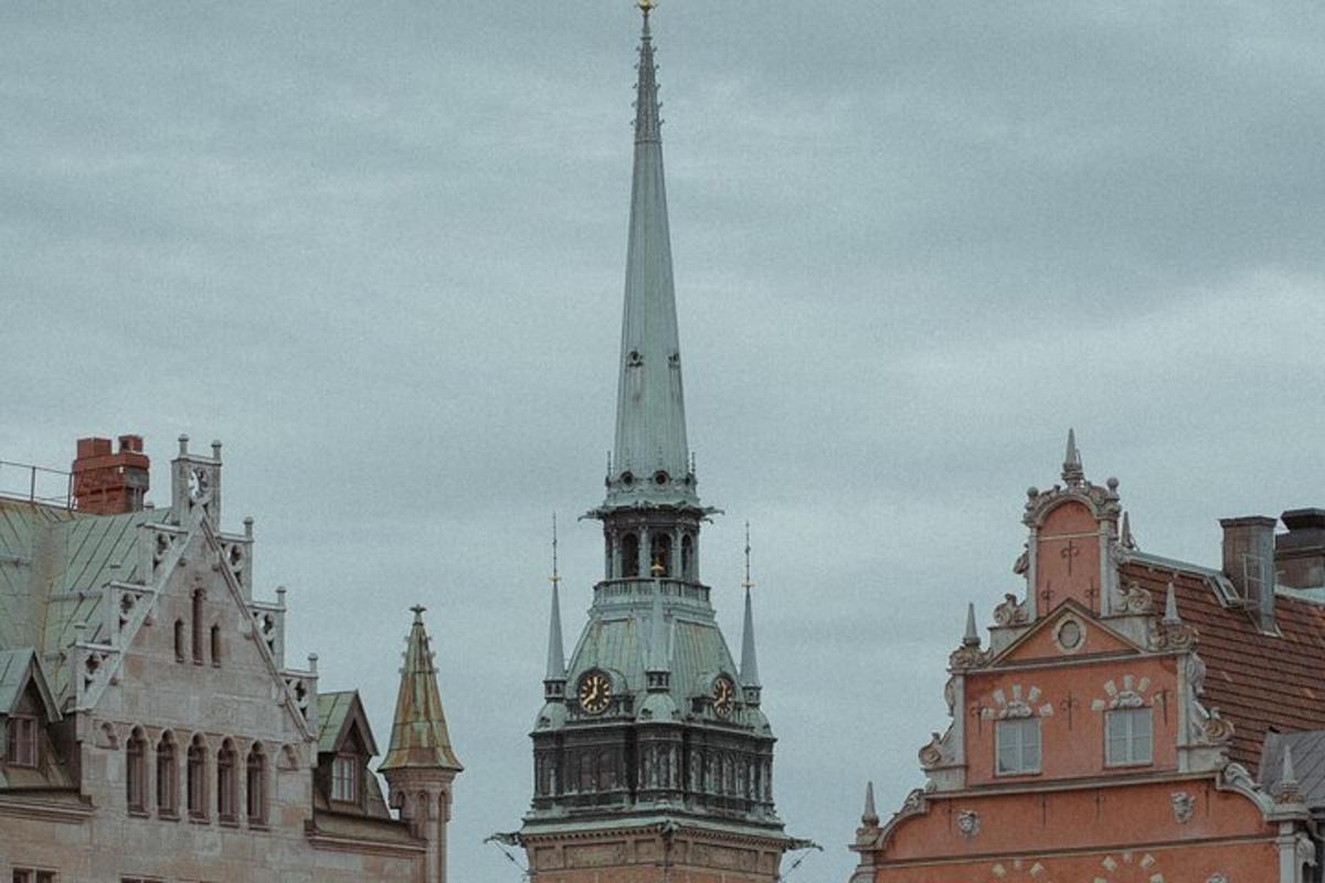 a tall steeple of a building with a clock tower