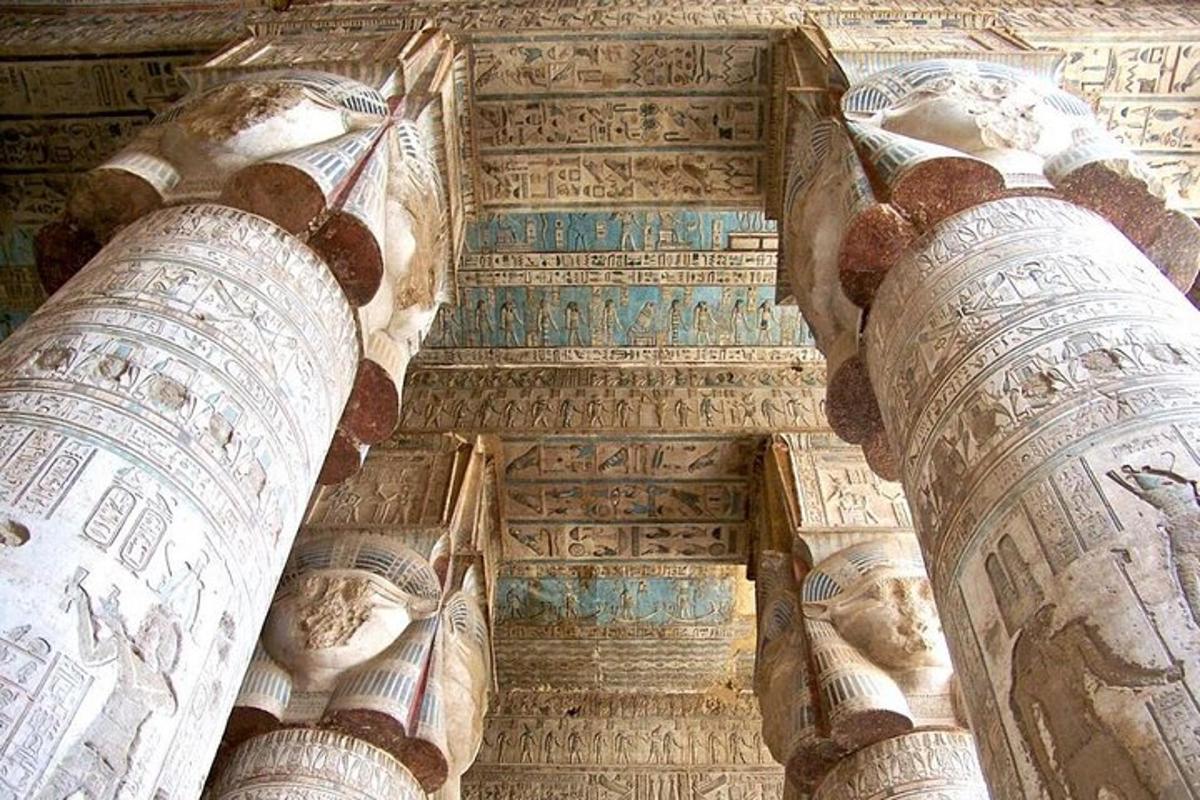 a ceiling of a building with paintings on it