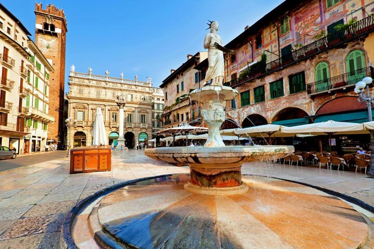 a fountain in the middle of a street with buildings