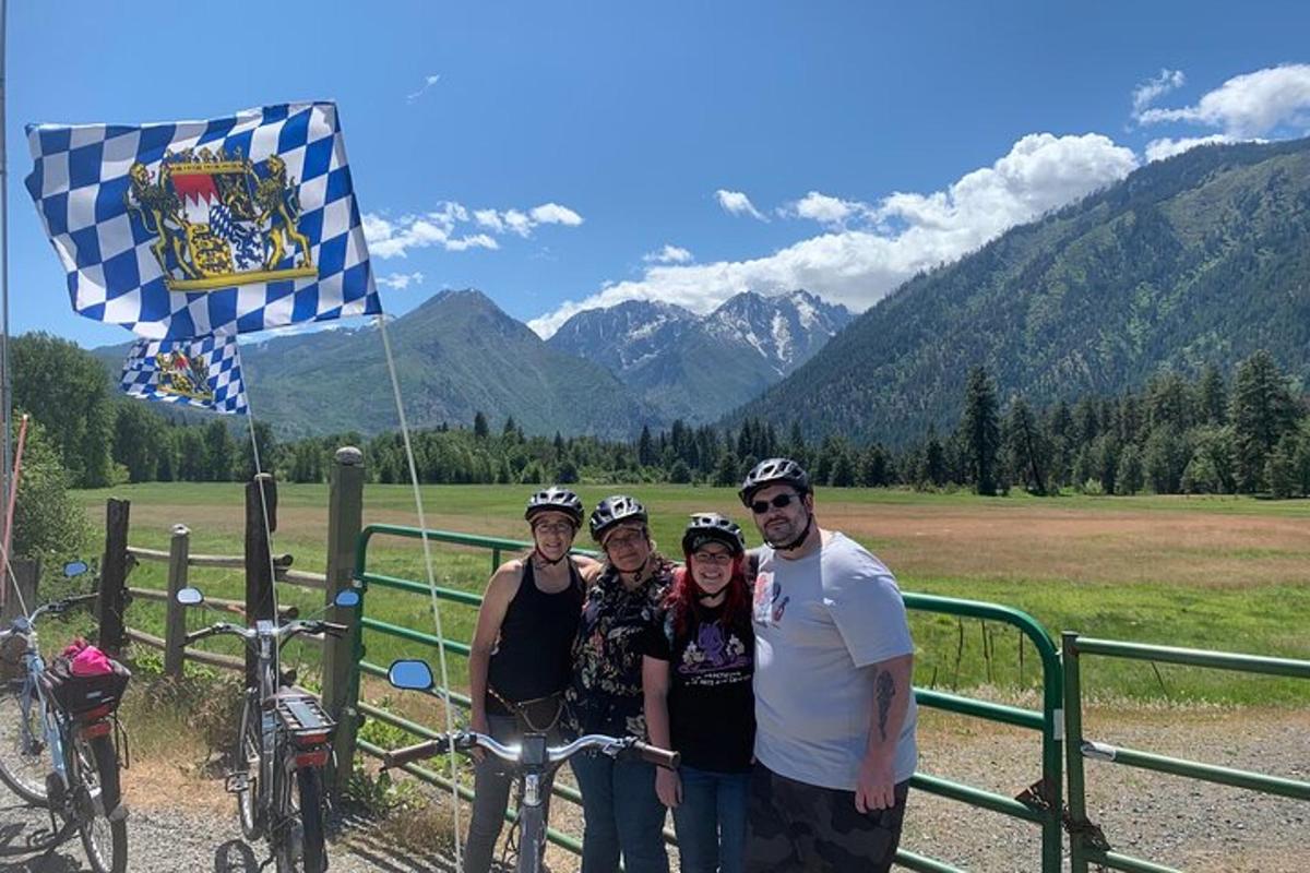 a group of people posing for a picture with their bikes