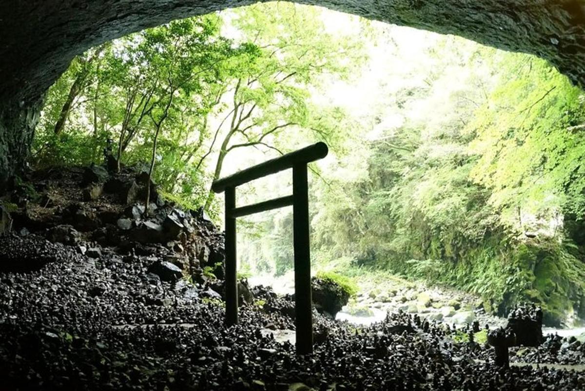 a cave with a sign in the middle of a river