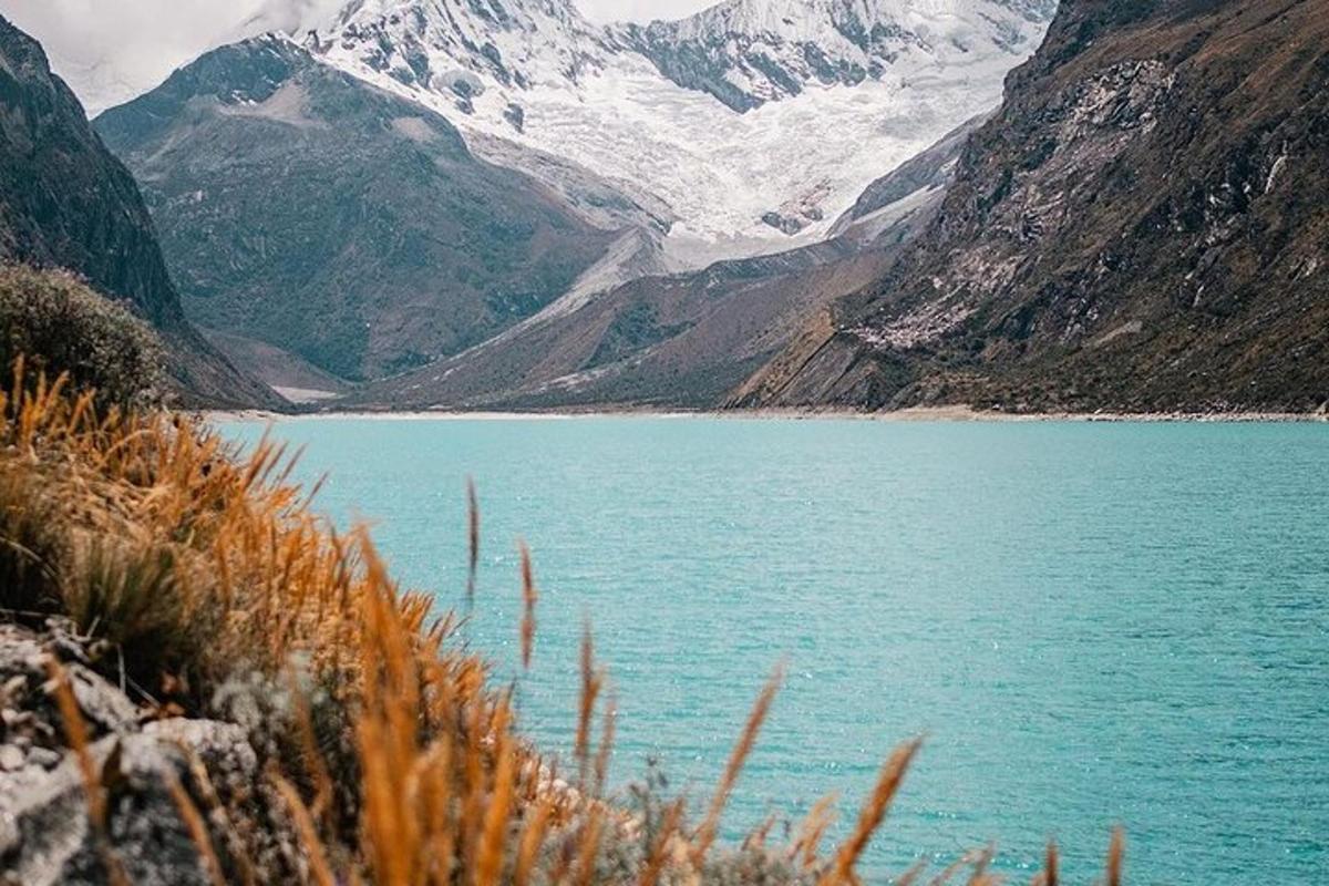 a large body of water with mountains in the background