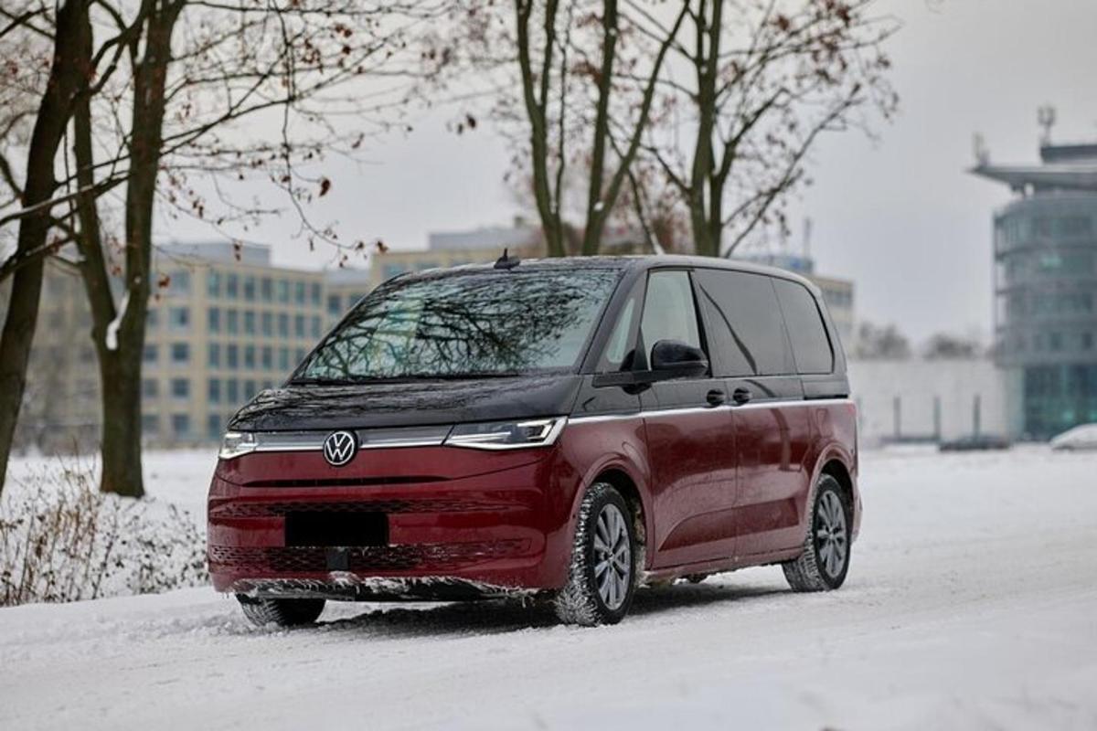 a red van parked on a snow covered street