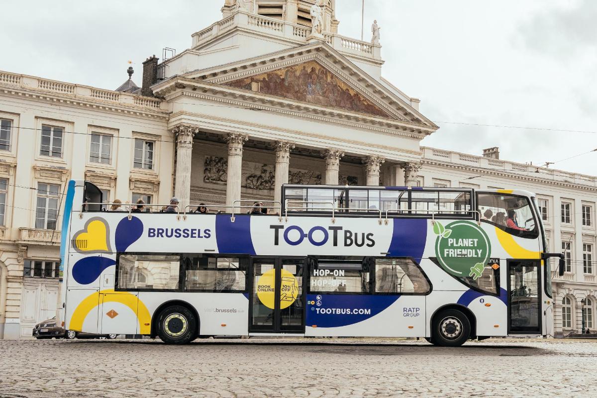 a double decker bus parked in front of a building