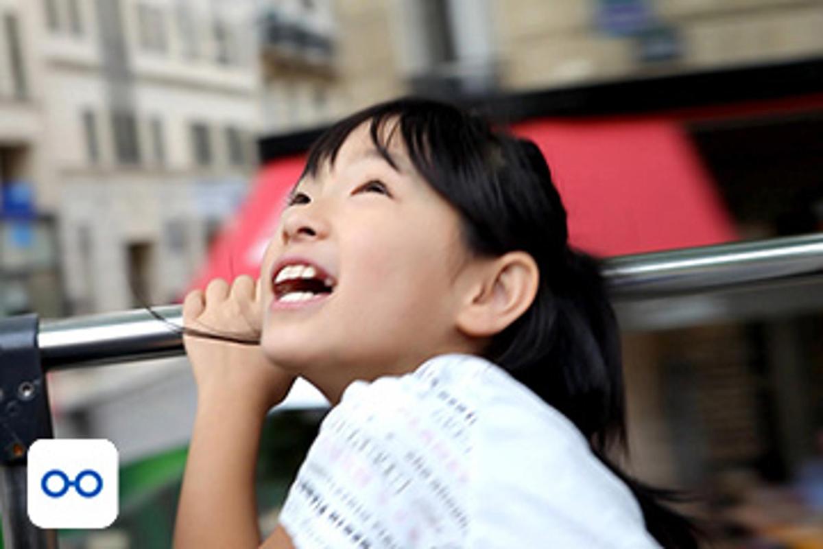 a young woman is looking up at the sky