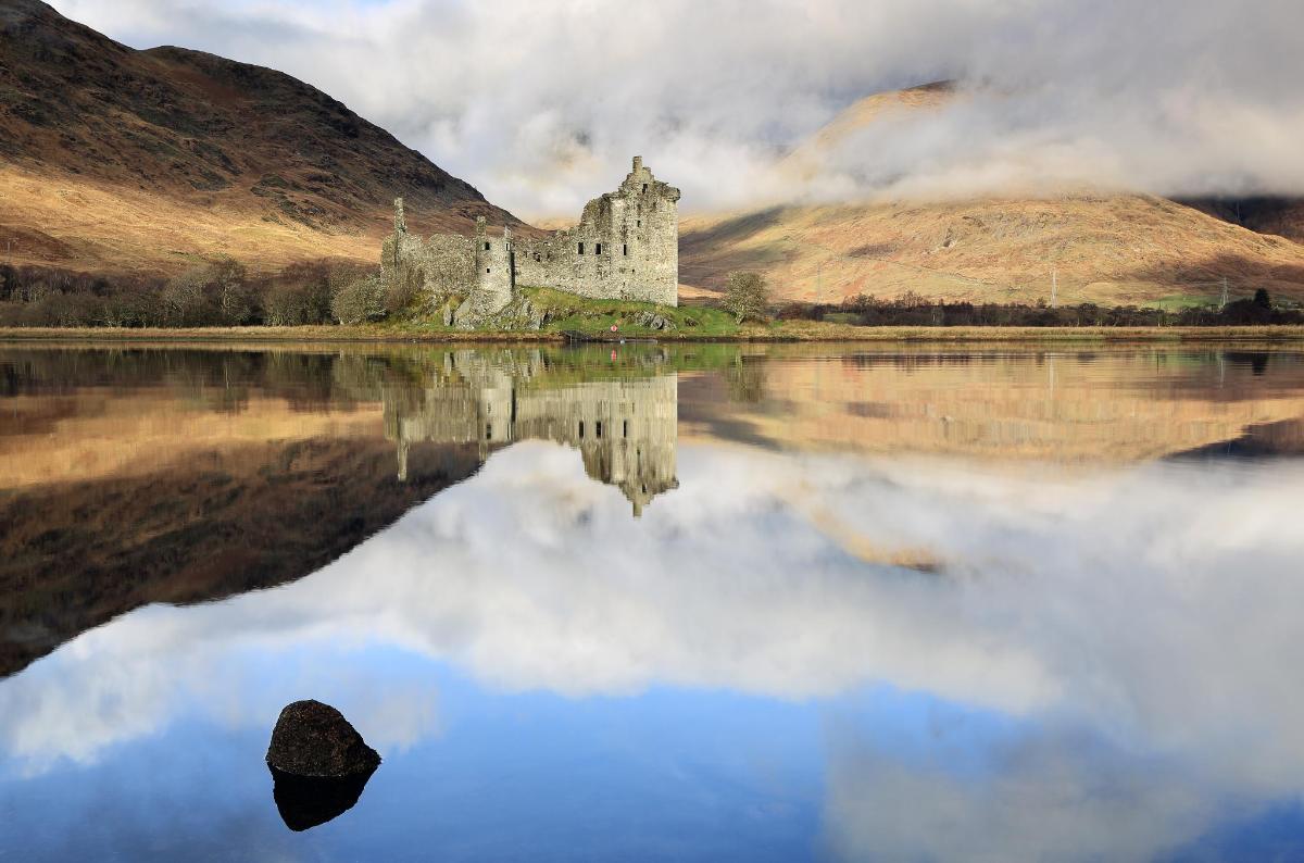 a castle in the middle of a body of water