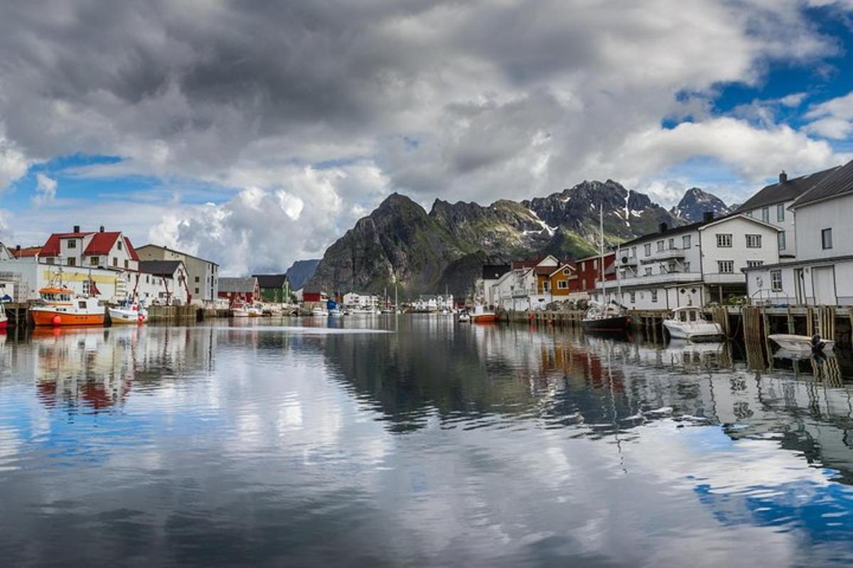 a river with houses and boats in a town