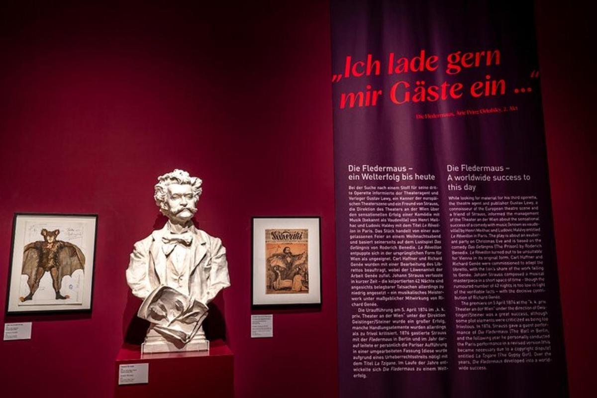 a exhibit in a museum with a statue and pictures