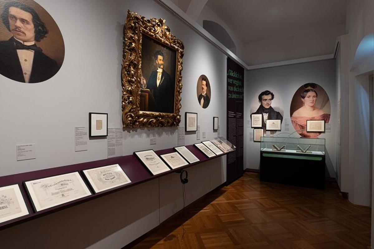 a exhibit in a museum with portraits of people