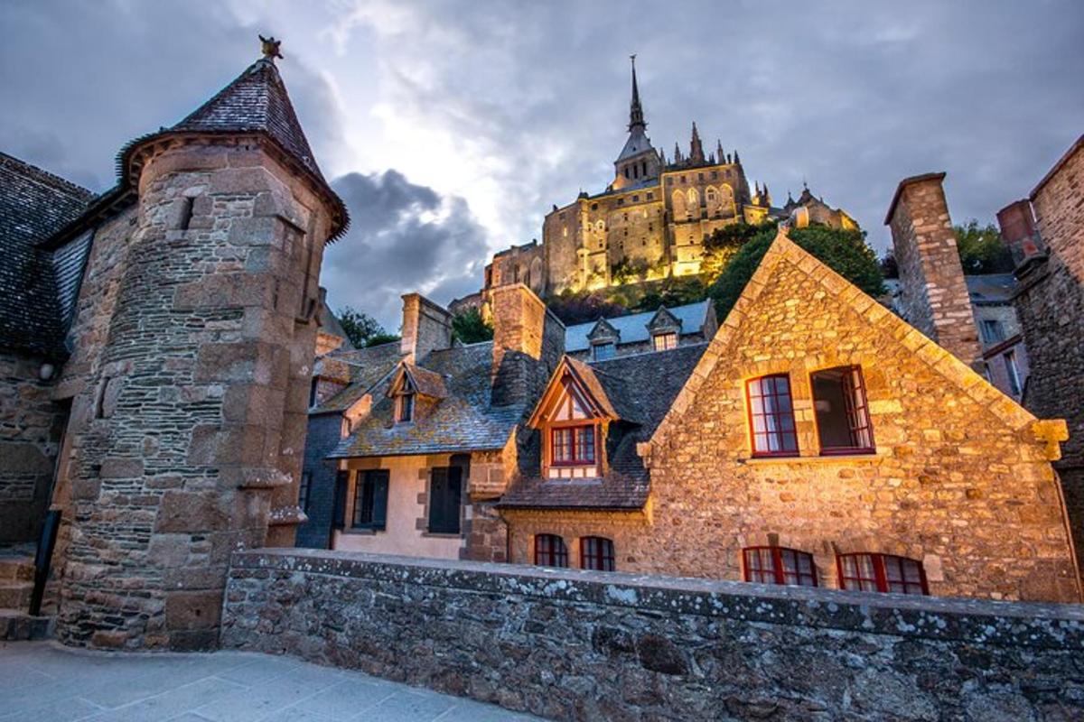 an old building with a castle in the background