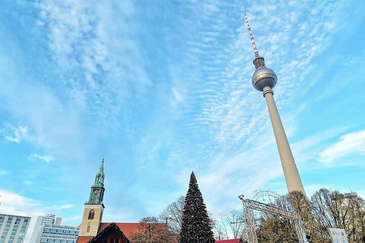 a tall pole with a christmas tree in front of a church