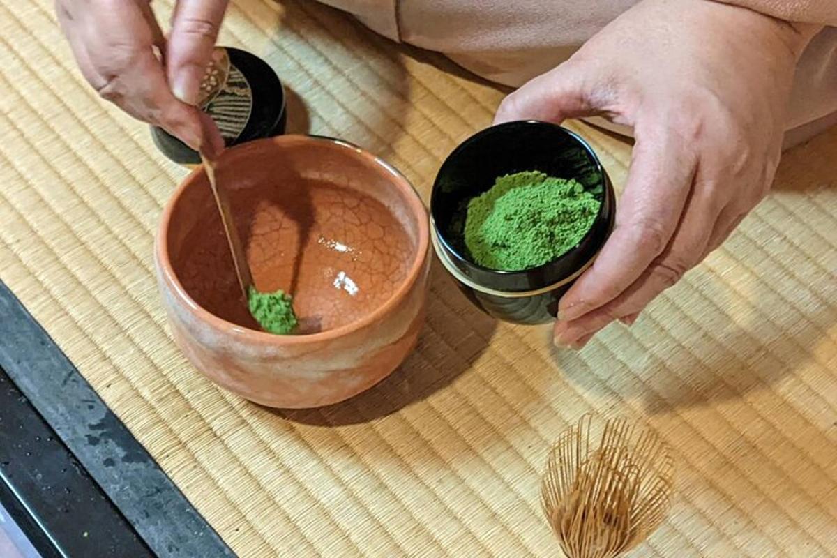 a person is putting green sauce in a bowl