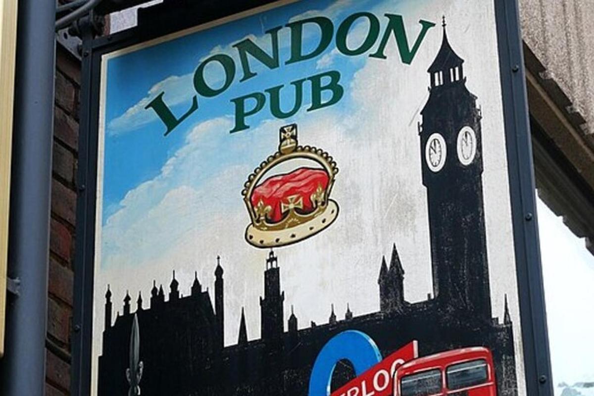 a sign for aondon pub with a sandwich and big ben