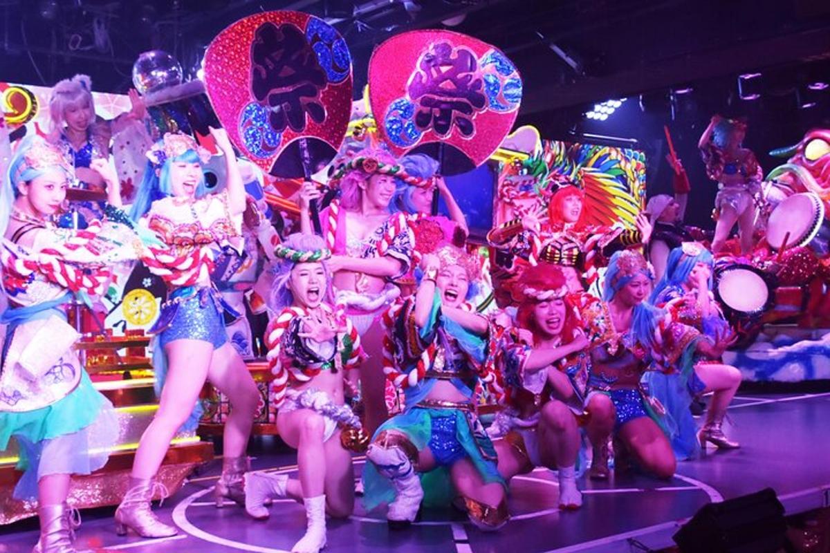 a group of women in costumes on a stage