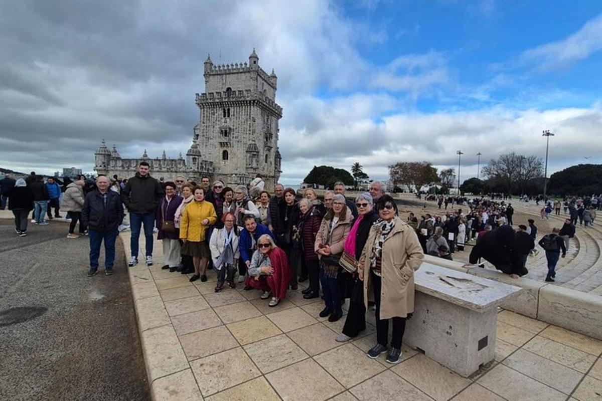 a group of people standing in front of a tower