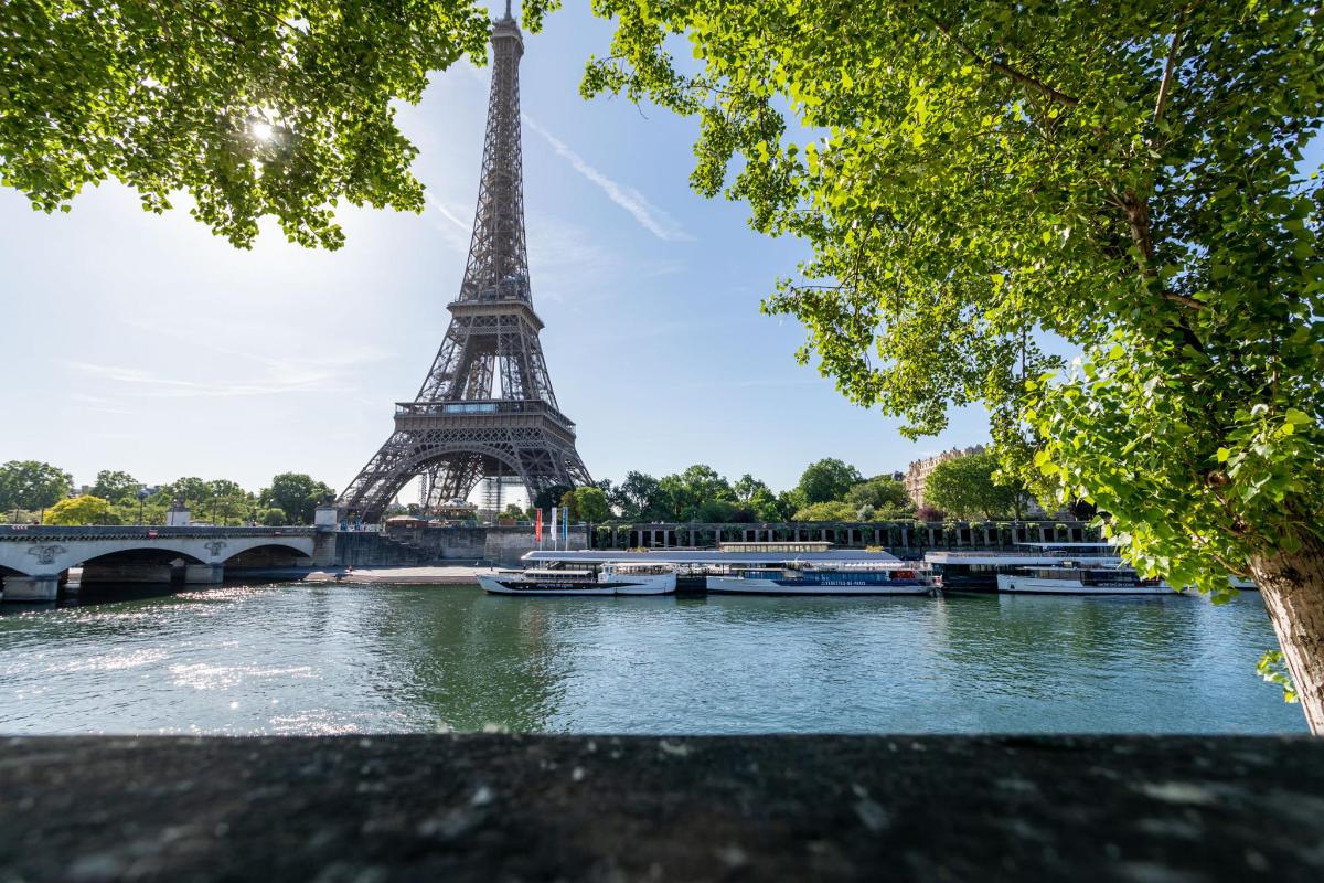a view of the eiffel tower from the river seine