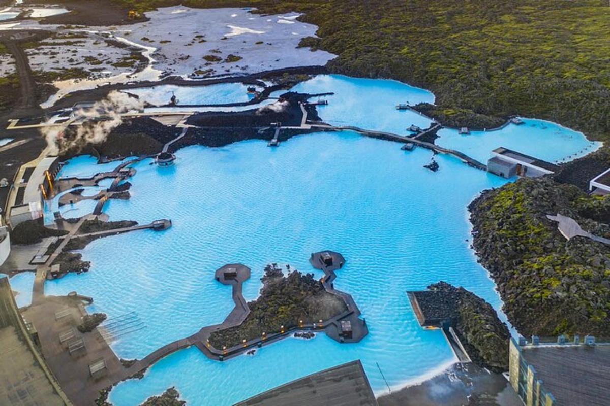 an aerial view of a blue pool of water