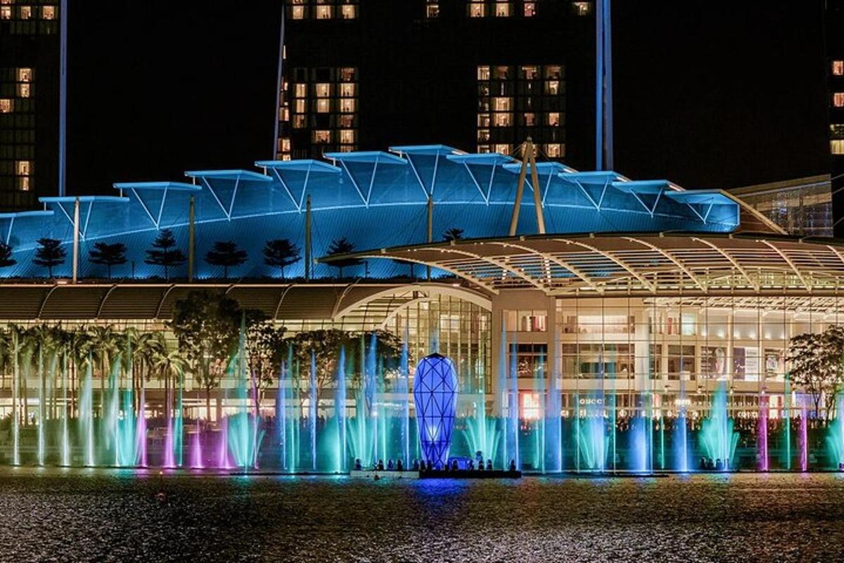 a large building with a fountain in front of it