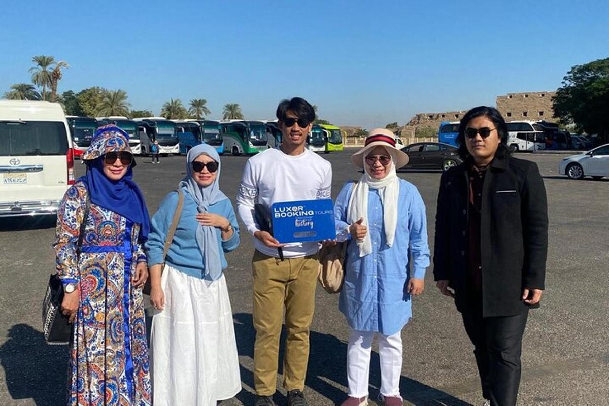 a group of people standing in a parking lot