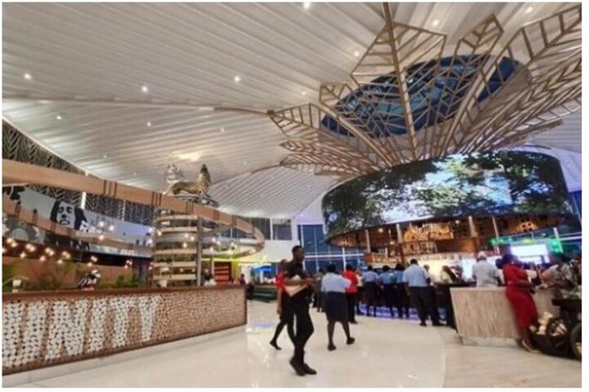 a group of people walking in a shopping mall