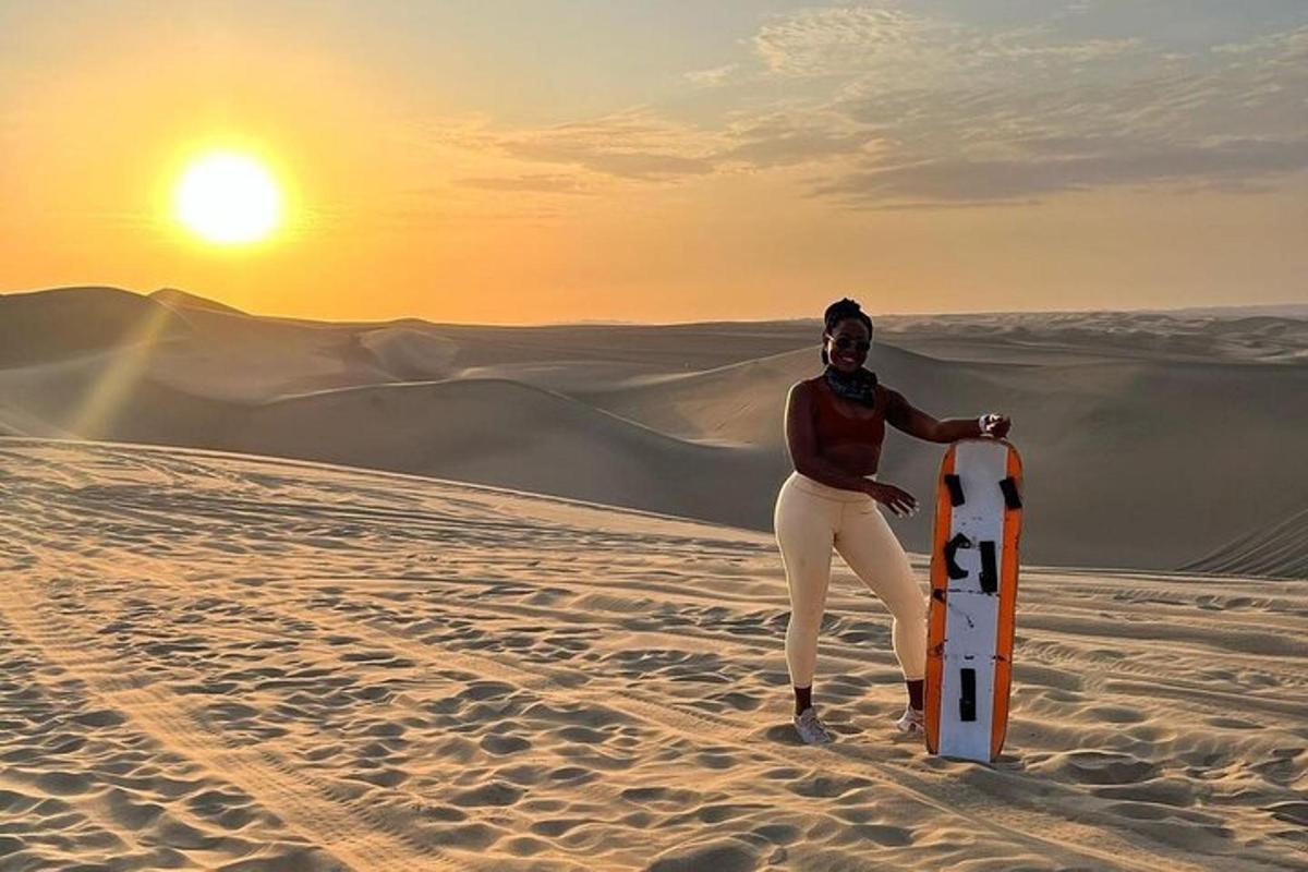 a man standing in the desert holding a surfboard