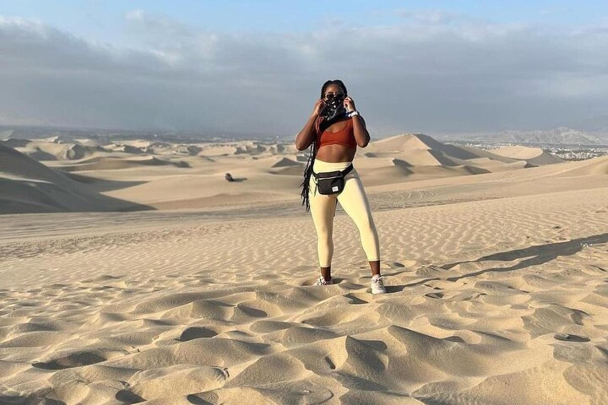 a woman taking a picture in the desert