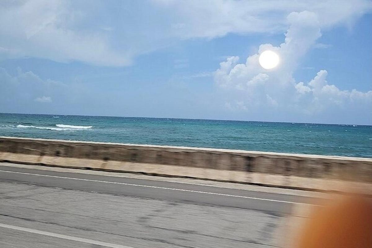 a view of the ocean from a bus window