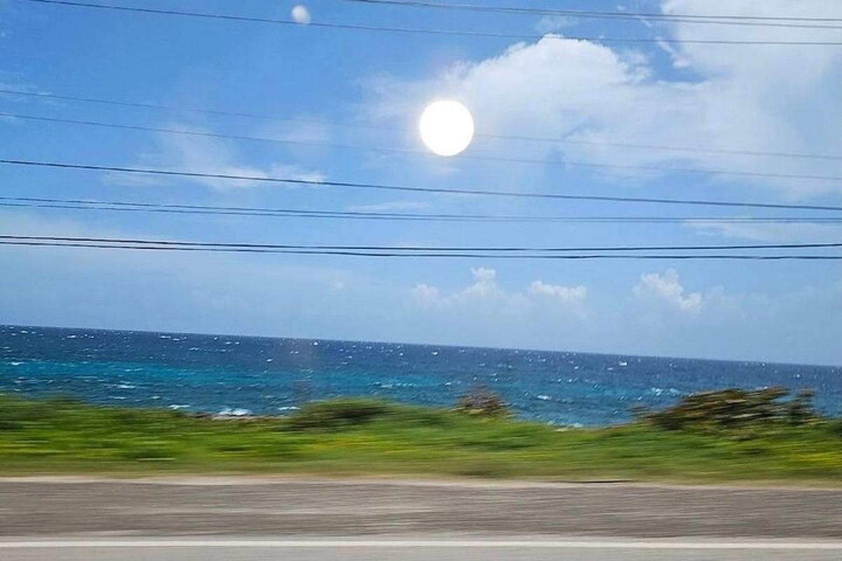 a view of the ocean from a train window