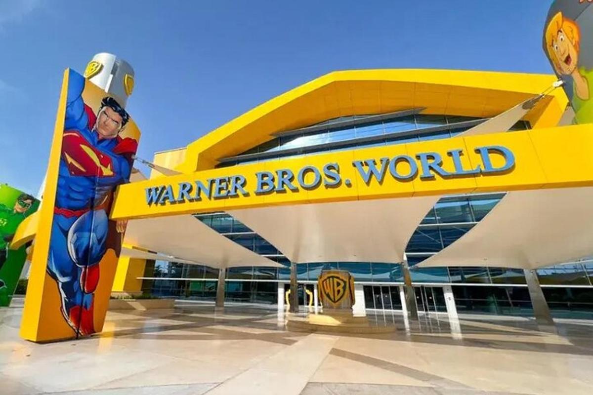 a superhero sign in front of a wener bros world building