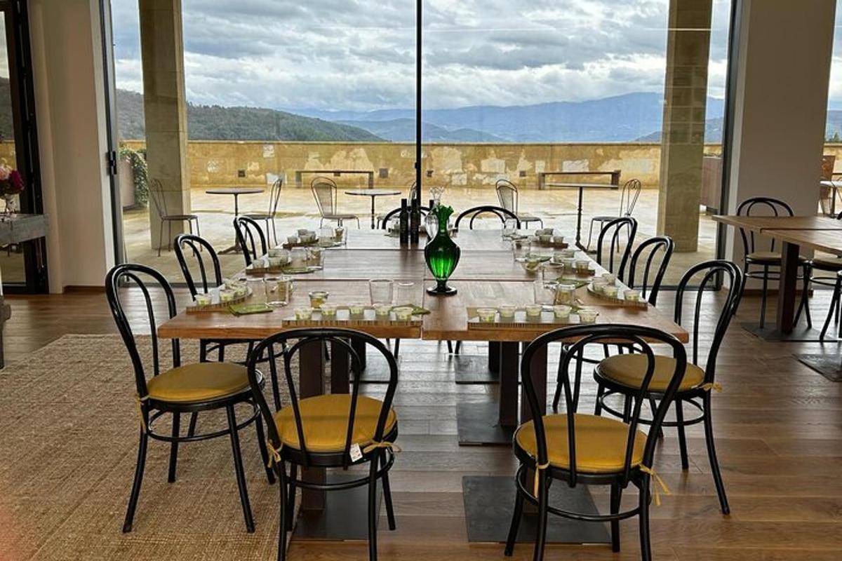 a dining room with a table and chairs with a view