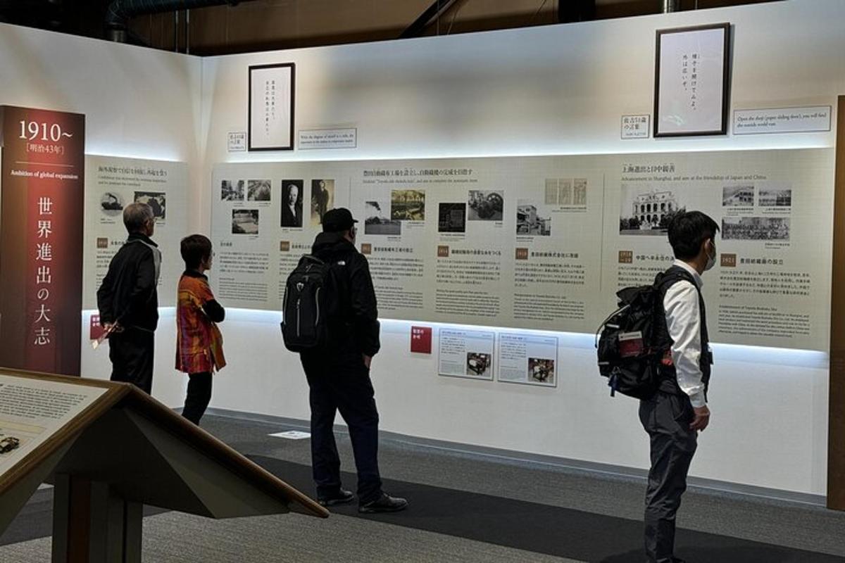 a group of people looking at a display in a museum