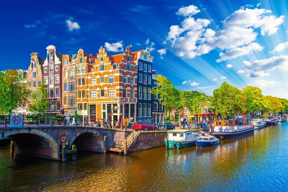 a river with boats and buildings and a bridge