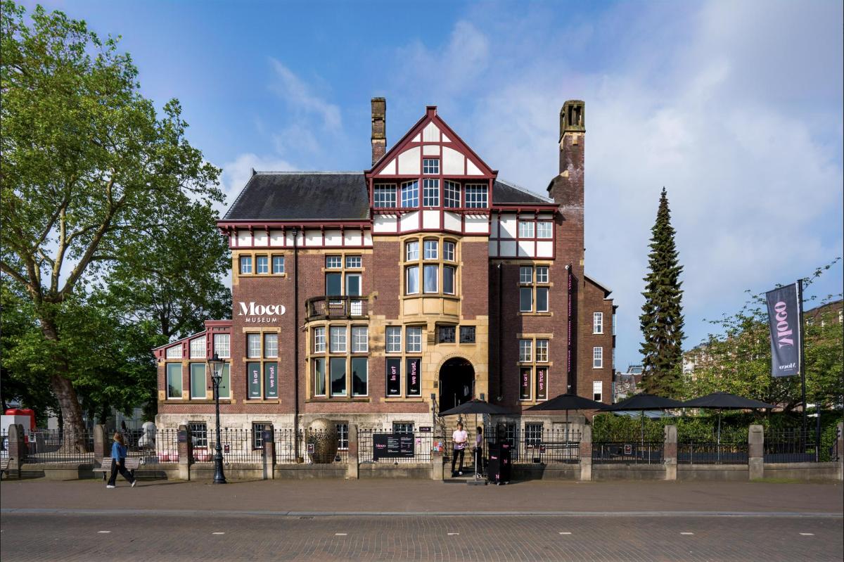 a large brick building with a chimney