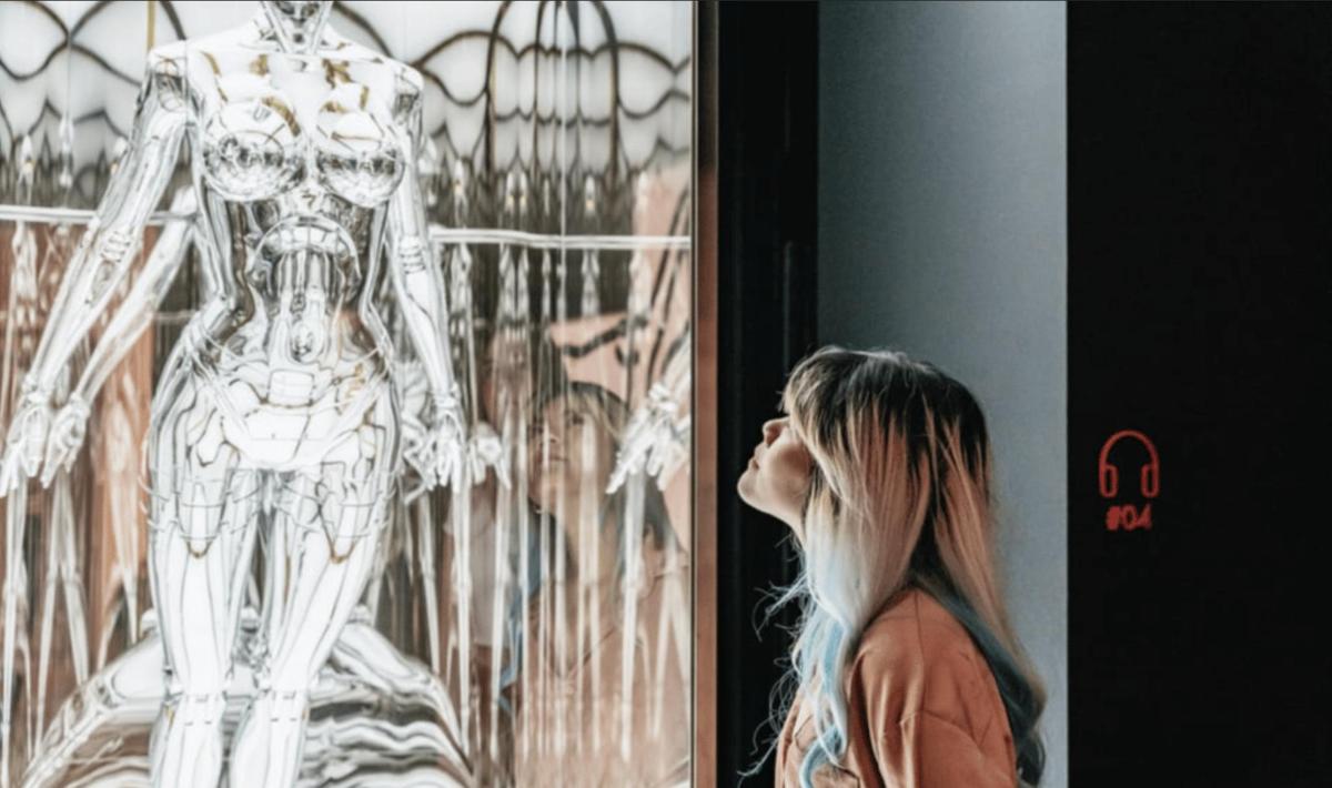 a woman looking at a drawing of a skeleton