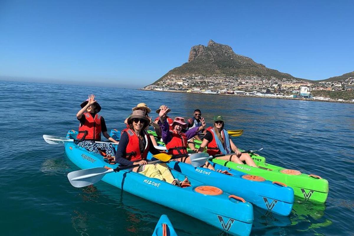 a group of people riding on kayaks in the water