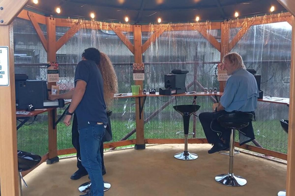 a couple of people standing in a barber shop