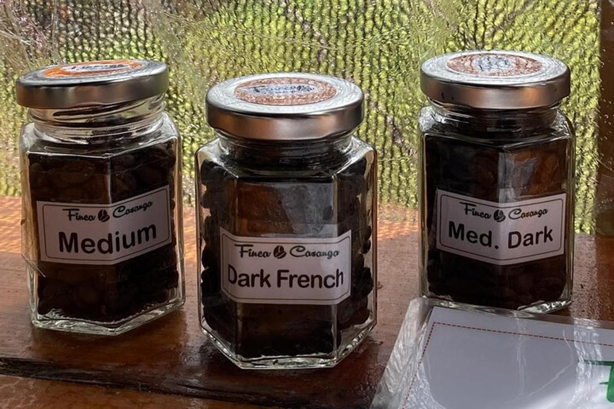 three jars of jam sitting on a table