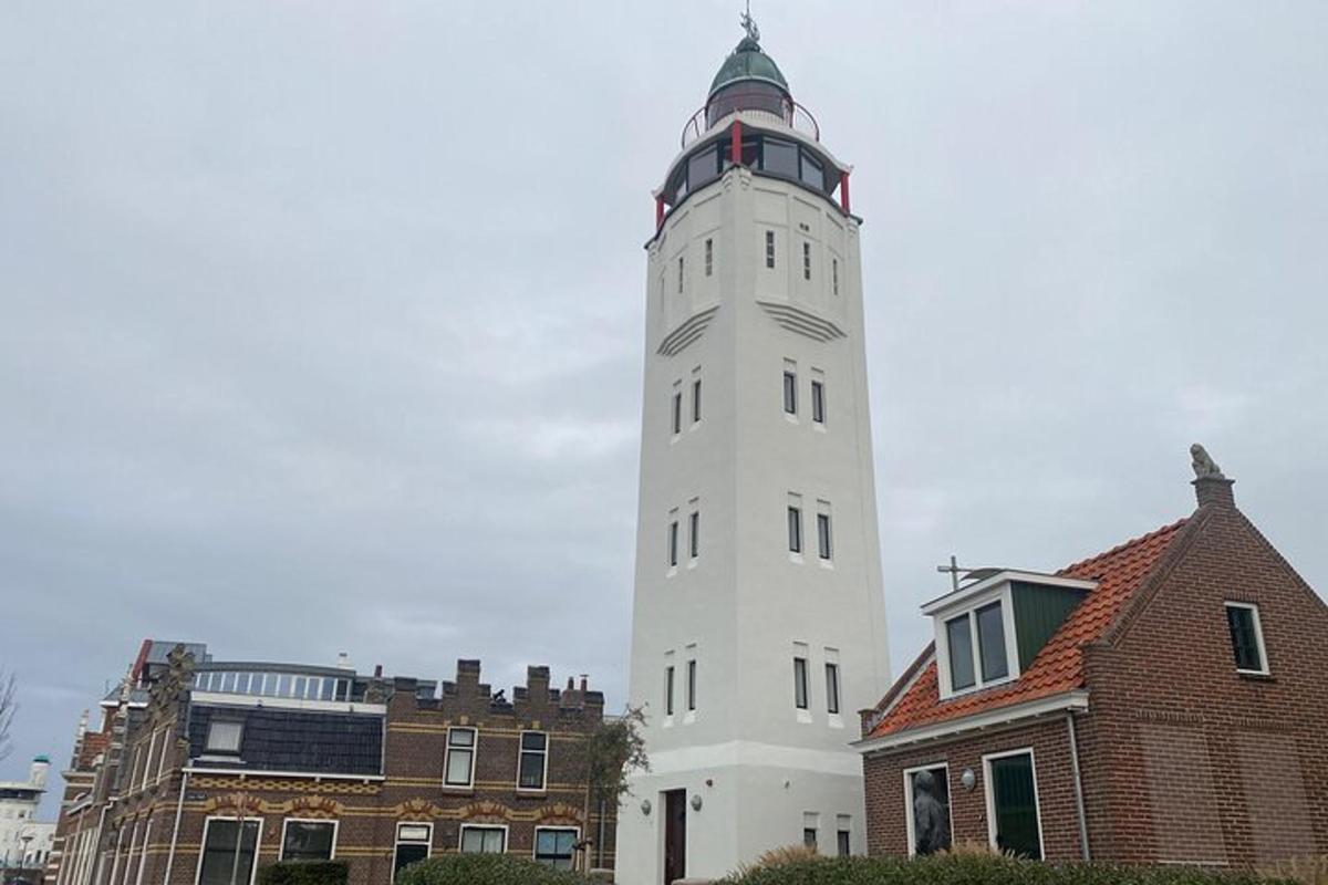 a white tower with a clock on top of a building