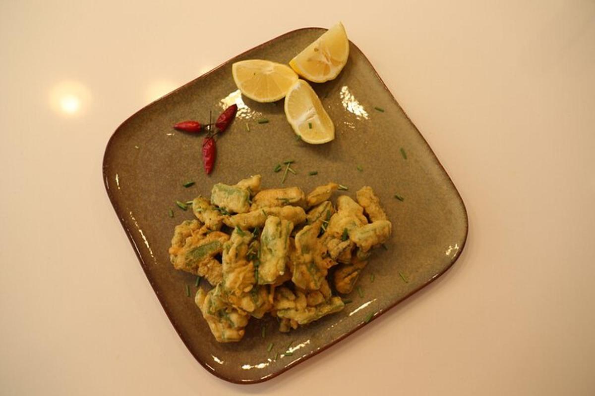 a plate of food with lemon slices on it
