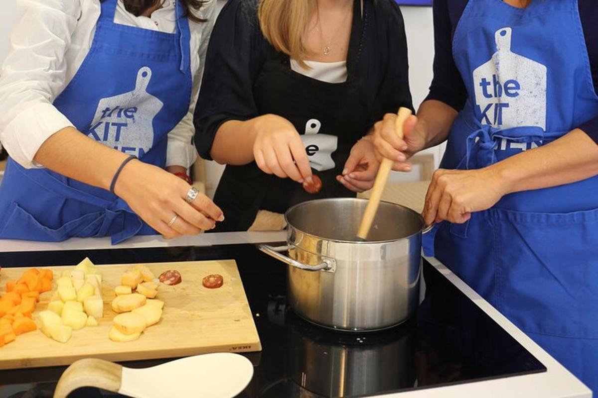 a group of people preparing food in a kitchen
