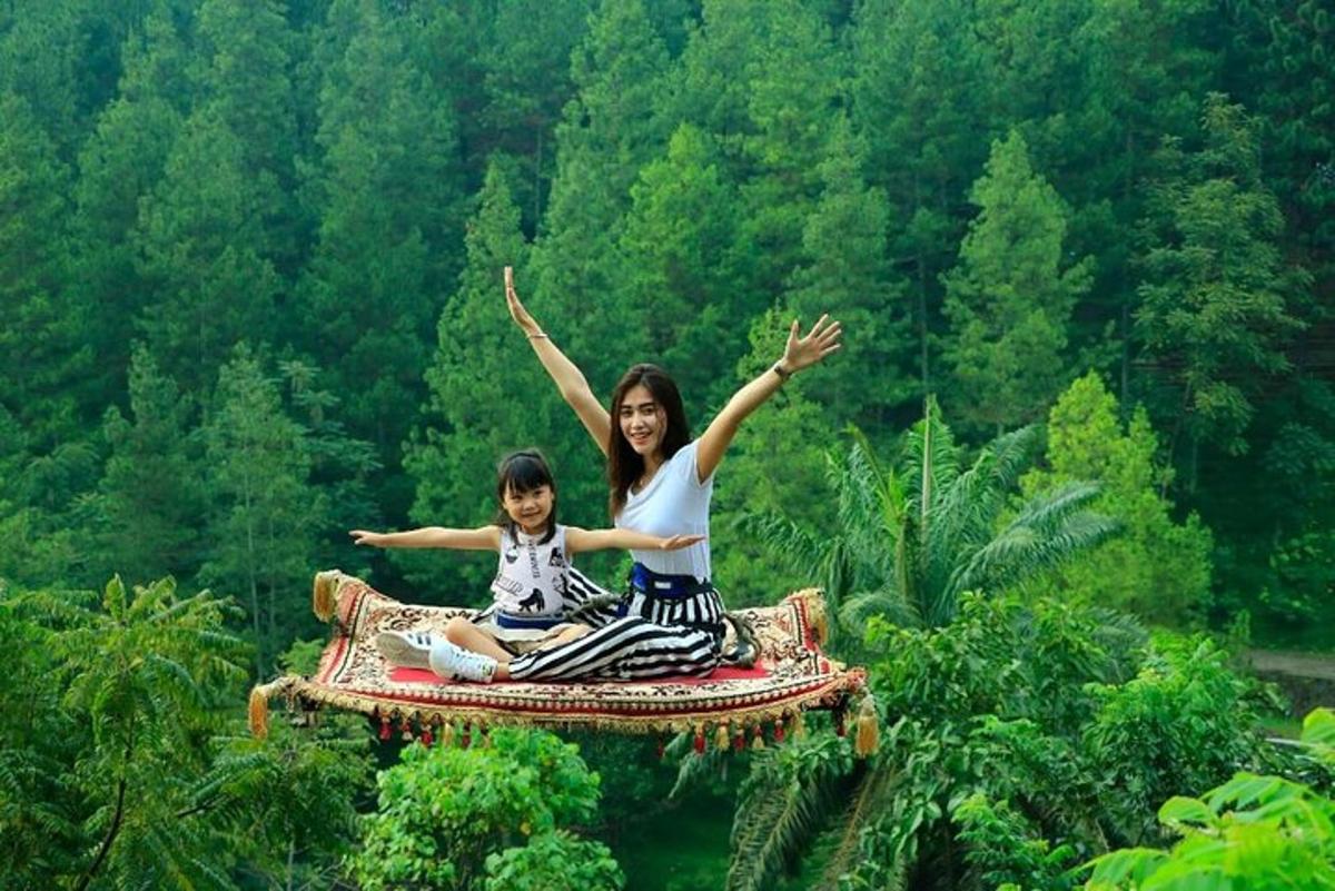 a woman and a child are sitting on a blanket
